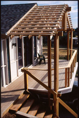 When David Johnston added an office to his home, the eco-remodel included structural insulated panels, engineered wood for all large structural beams, durable fiber cement siding, large overhangs to protect the siding from moisture, recycled plastic decking, low-E windows, a ceiling fan, plenty of natural daylight, and Interface carpet.